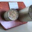 Two tins filled with grain and chaff attached to a board