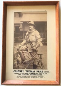 Framed photograph of soldier with hat and gloves