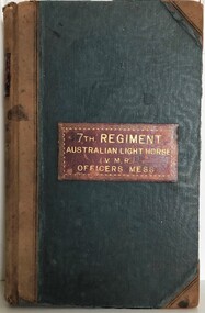 Large book with leather spine and corner protection.