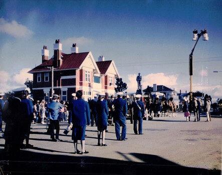People in uniform drawn up in town street