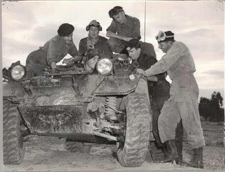 Five soldiers with small tank