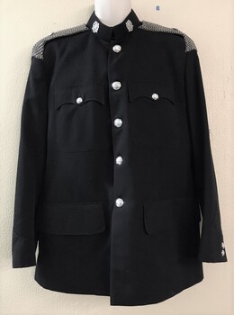 Army jacket with silver buttons and badges