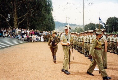 Soldiers, one with a sword, on parade ground