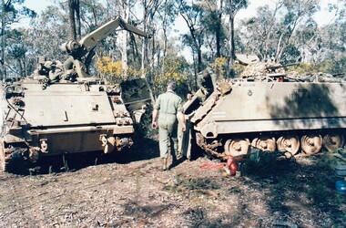 Two tanks, one with a crane.