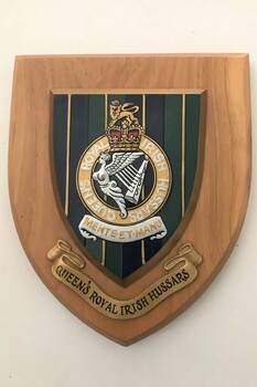 Wooden plaque with badge and title