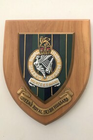 Wooden plaque with badge and title