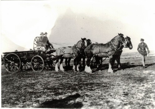 Soldiers on wagon with team of horses