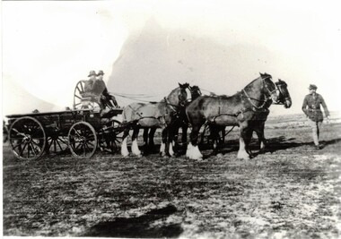 Soldiers on wagon with team of horses