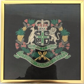 Framed embroidered badge with kangaroo, lion and wattle.