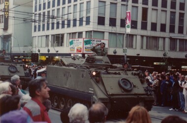 Soldier in tank in city street