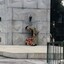Soldier laying wreath at memorial