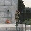 Soldier saluting  at a War Memorial