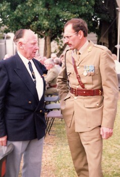 A civilian and a soldier talking
