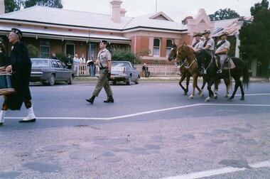 Soldier with sword and three horsemen.