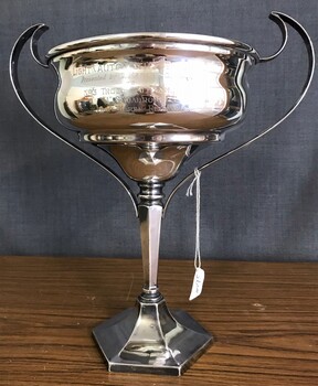 Silver cup with handles and inscriptiion