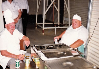 Two army cooks in kitchen
