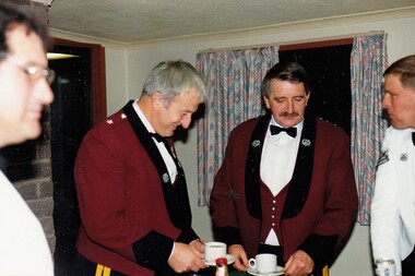 Two officers with coffee cups