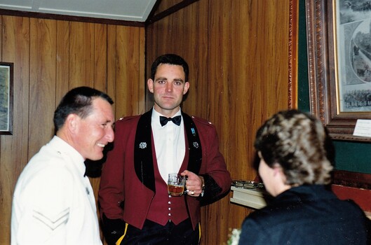 Two soldiers with lady at Dinner