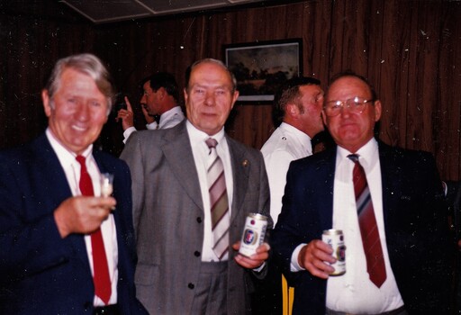 Three former soldiers enjoying drinks.