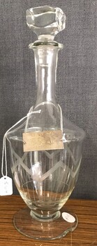 Decorative glass bottle with plate on chain round neck