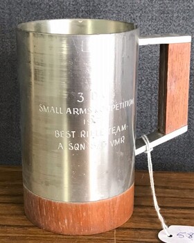 Pewter drinking cup with engraving on side