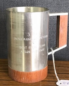 Pewter drinking cup with engraving on side