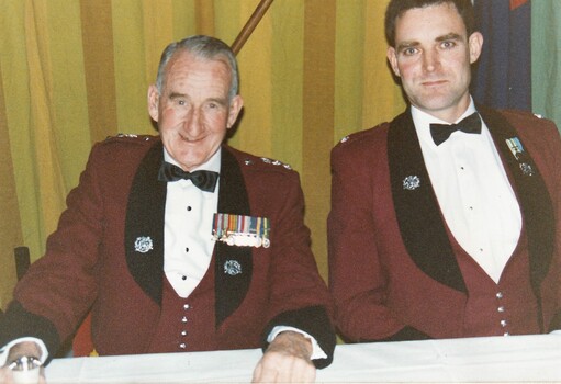 Two army officers in formal uniform.