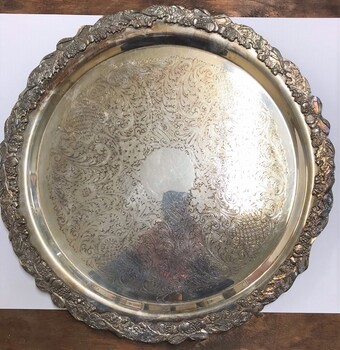 Large metal with decorative rim.