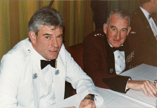 Two soldiers in formal uniforms