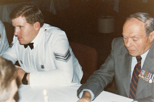 Soldier in formal uniform and a civilian