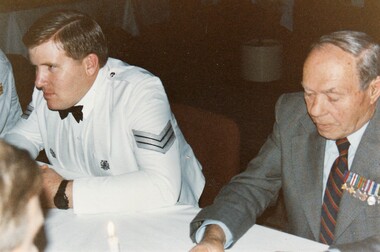 Soldier in formal uniform and a civilian