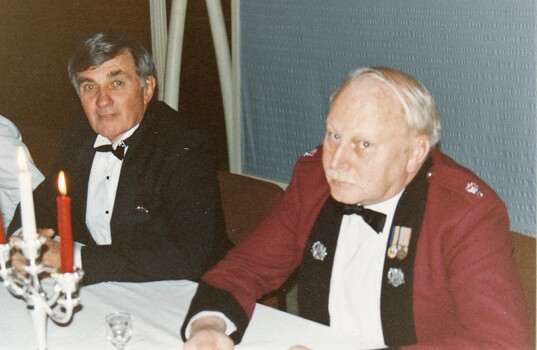   Civilan and soldier in formal dress  .