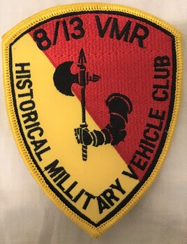 Coloured embroidered badge with battle axe motif.