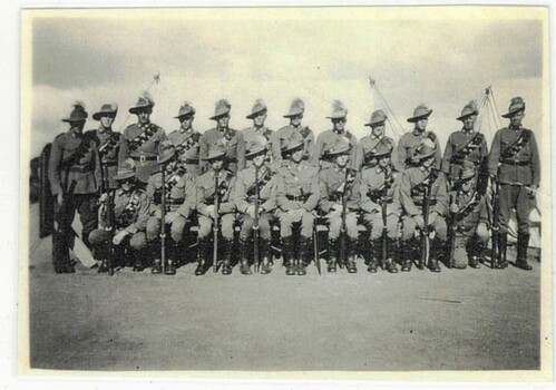 Group of soldiers seated for photograph