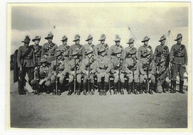 Group of soldiers seated for photograph
