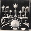 Photograph of collection of cups and trophies.