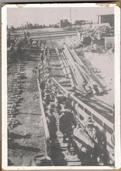 Line of soldiers ascending ship gangway