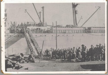 Soldiers on wharf where ship is loading