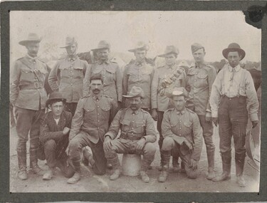 Group of nine soldiers with two civilians