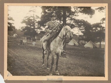 Soldier with rifle on horseback