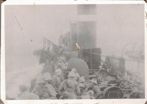 Soldiers on deck of warship.