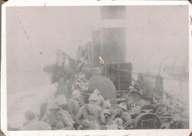 Soldiers on deck of warship.