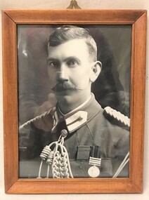 Framed photograph of soldier with medals