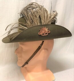 Slouch hat with badge and feathers in hat band