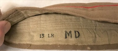 Inside of hat band with writing stamped on it.