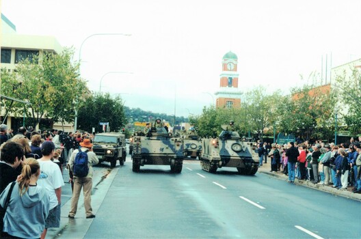 Two army tanks in city street