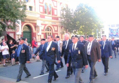 Group of former soldiers marching