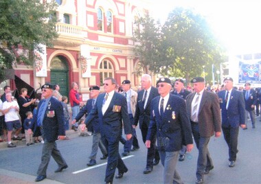 Group of former soldiers marching