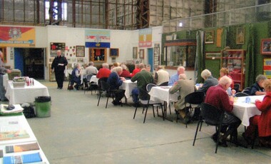 People lunching at tables in museum