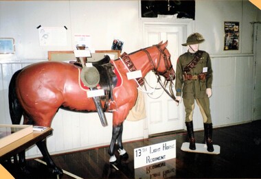 Model horse and soldier with rifle and saddle